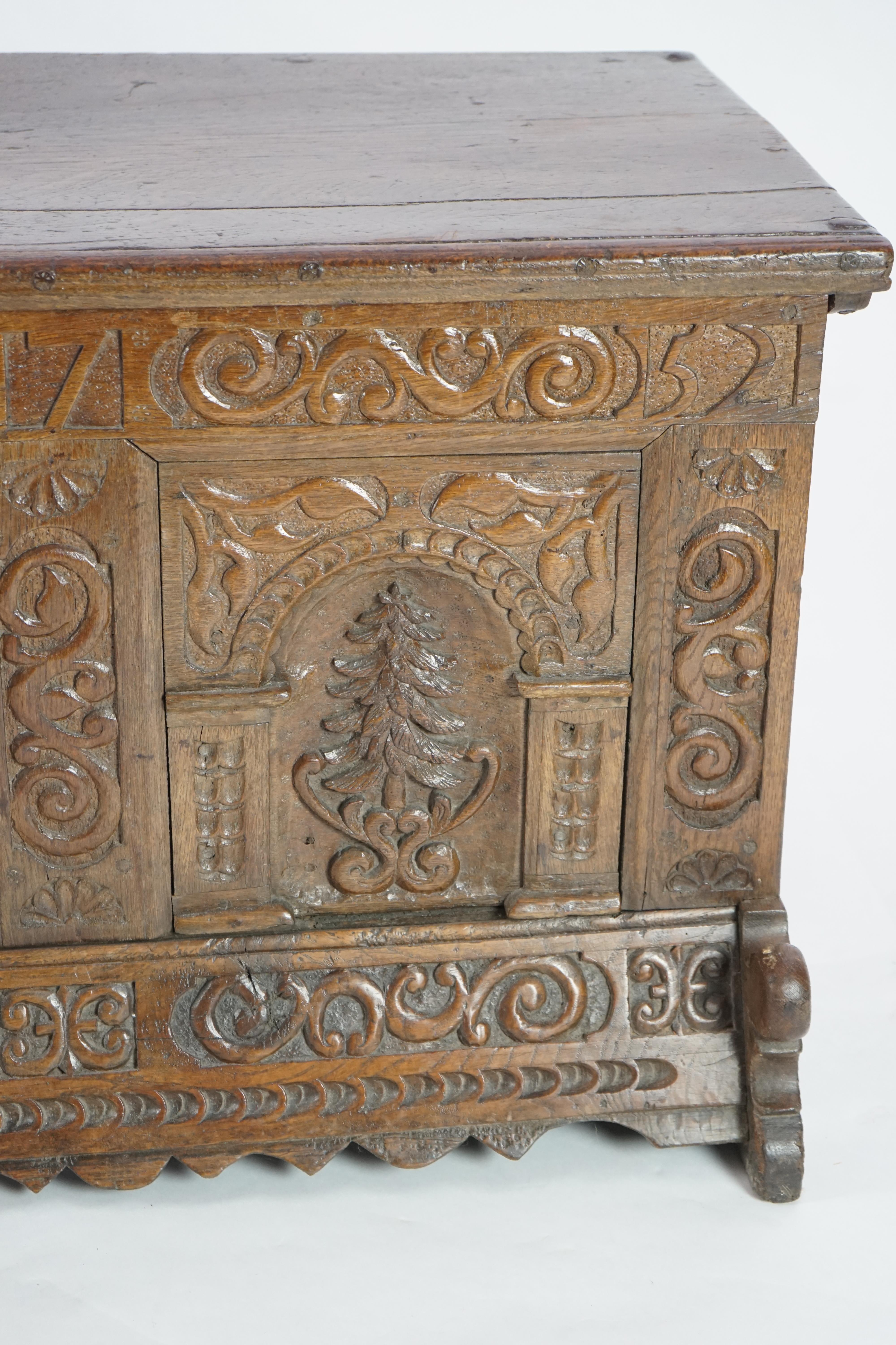 A mid 18th century German carved oak marriage chest